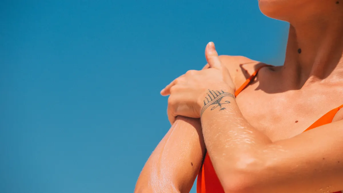Baking soda free natural deodorant for sensitive skin Close-up of woman touching her underarm