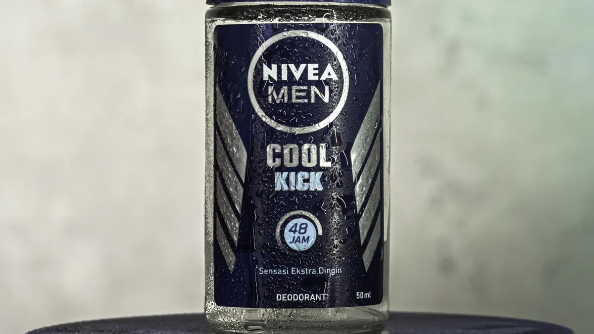 How to switch to natural deodorant Nivea Men deodorant bottle on a plain background