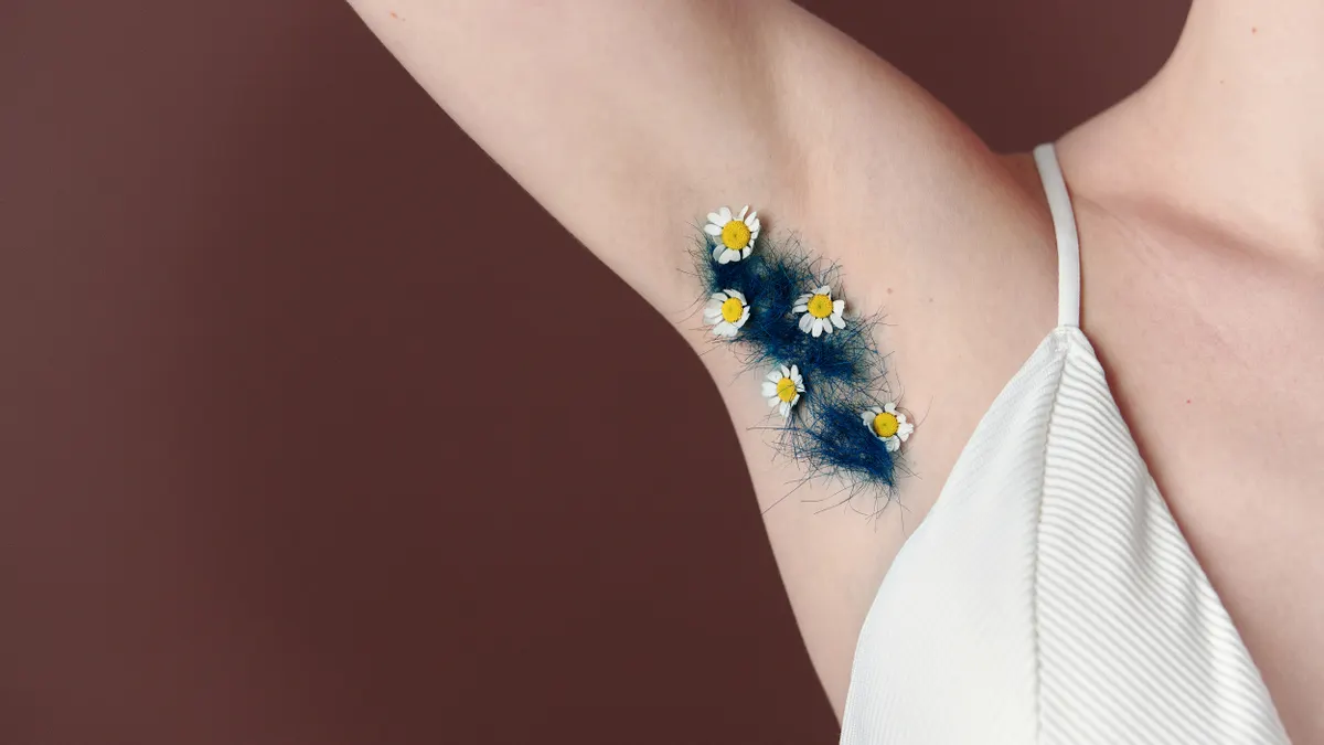 Close-up of arm with dark underarm patch